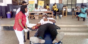 A student donating his blood