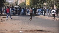 Sudanese protesters confront police during a demonstration against the military coup in Khartoum