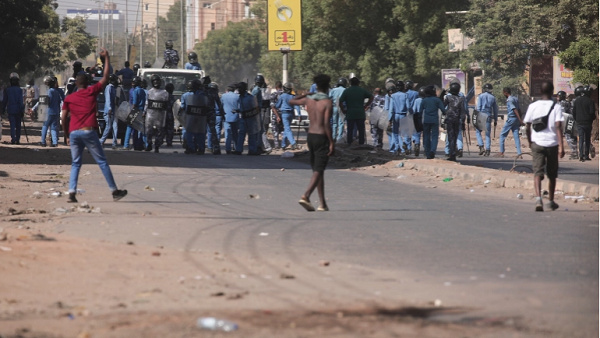 Sudanese protesters confront police during a demonstration against the military coup in Khartoum