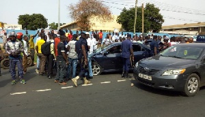 Police and civilians at a recent robbery scene at the North Industrial Area