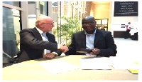 Mr. Nelson Agyei CEO of Hallmark Oil in a handshake with Mr. Rene Huting, Area Business Manager