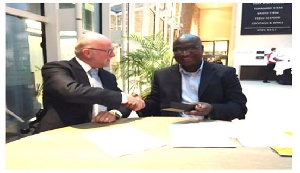 Mr. Nelson Agyei CEO of Hallmark Oil in a handshake with Mr. Rene Huting, Area Business Manager