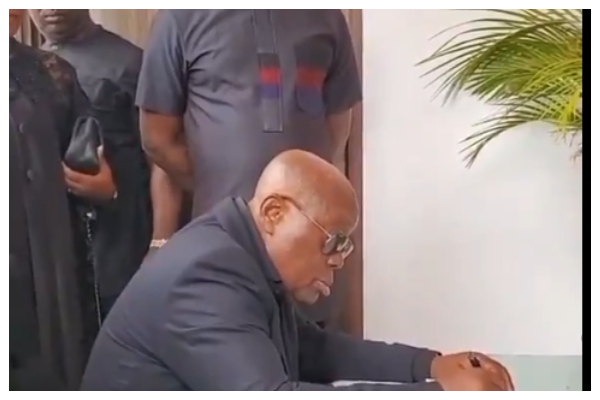 Nana Addo Dankwa Akufo-Addo signing the book of condolence