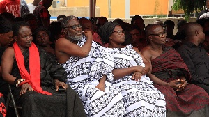 Ebony's parents in white mourning clothes