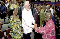 President Akufo-Addo in a handshake with Former President John Rawlings
