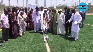 Sheikh Osman Nuhu Sharubutu kicks a ball to commission the new Zulka Sports Arena in Dansoman