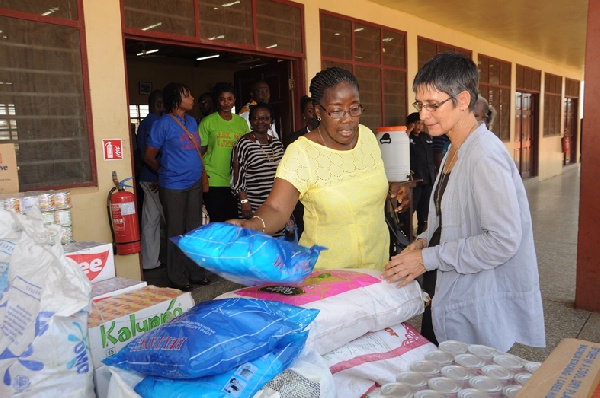 Mrs. Matilda Amissah-Arthur presenting items