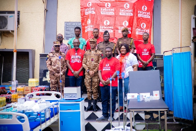 Photo of some Prison officers and officials from Telecel Ghana