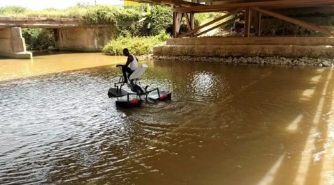 Frank Darko riding on his water bike