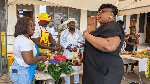 MCE for Adentan, Ella Esinam Christine Nongo (r) interacting with some exhibitors at the event