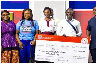 Mercy Adjeley Okang (M) pictured with her scholarship award after the presentation