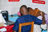 Health officer scans a pregnant woman at Telecel Foundation’s Rural Ultrasound programme