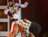 Stonebwoy on stage with a dancer