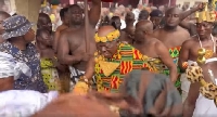 Asantehene Otumfuo Osei Tutu II (with triangle gold ornament on his chest) dancing