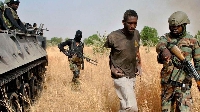 Nigerian soldiers capture a Boko Haram terrorist