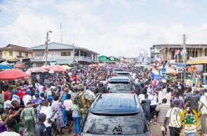 A crowd surrounding President Akufo-Addo's entourage as the toured through parts of the Eastern Reg.
