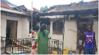 Residents inspect the damage of the fire that claimed six lives at Namulanda B Zone, Kajjansi Town