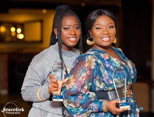 Stacy Amoateng and her daughter Calista Meusique Ama Adoma Amoateng pose with their plaques