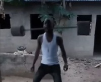 Nigerian man lifting a 