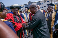President Mahama congratulating Chief Momodu after he was conferred with honourary Doctorate degree
