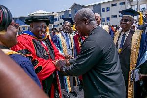 President Mahama congratulating Chief Momodu after he was conferred with honourary Doctorate degree