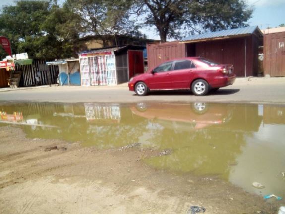 Waste water from the system seeps through the streets of Tema