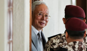 Malaysia's former Prime Minister Najib Razak is escorted by prison guards