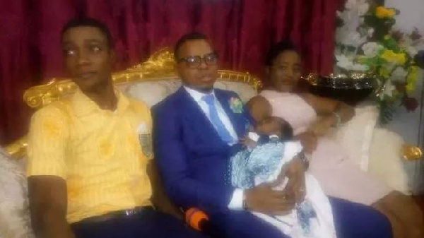 The teenage couple with Bishop Obinim and their baby