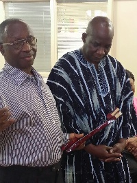 Mr Yaw Nyarko, the immediate past President of GCAO presenting a plague to H. E. Dr Sulley Gariba, t