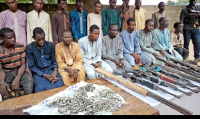 A group of men identified by Nigerian police as Boko Haram extremist fighters and leaders
