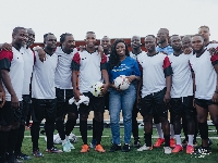 Claudia Abena Kwarteng Lumor flanked by some former Black Stars players