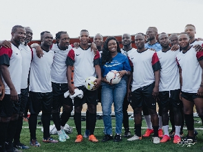 Claudia Abena Kwarteng Lumor flanked by some former Black Stars players