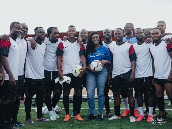 Claudia Abena Kwarteng Lumor flanked by some former Black Stars players