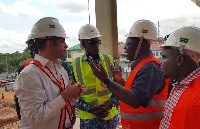 John Alexander Ackon (second right) in conversation with the consultant