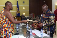 Chair of the Council, Nana Otuo Siriboe II presenting the report to President Akufo-Addo