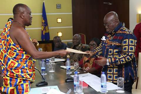 Chair of the Council, Nana Otuo Siriboe II presenting the report to President Akufo-Addo
