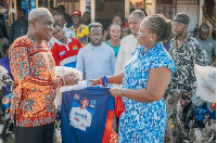 A senior member of the NPP, Amma Frimpomaa, (R) making a presentation