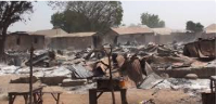 The attackers burned down shops and homes during the raid on Woro