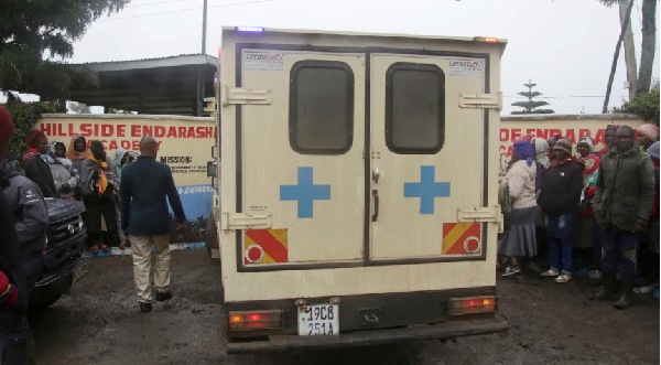 An ambulance arrives at the Hillside Endarasha Primary school following the deadly fire on Friday