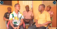 Richard Asare (left) in the front row speaking to an interviewer