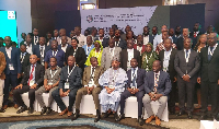 Participants in a group photo after the forum