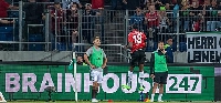 Köhn in number 18 shirt celebrates a goal
