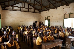 A group of school children in a classroom