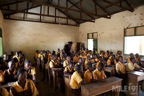 A group of school children in a classroom