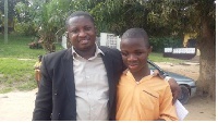 Raymond Ablorh with a student of one of the Schools for the Blind.