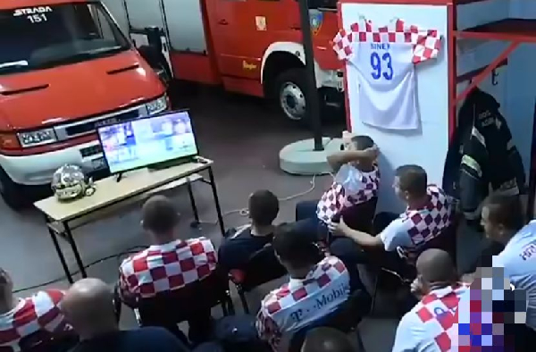 Firefighters from Croatia watching the game