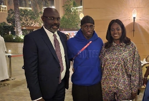 President George Weah with son Timothy and wife Clar