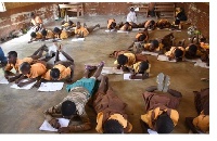 Some students lying on the floor during examinations