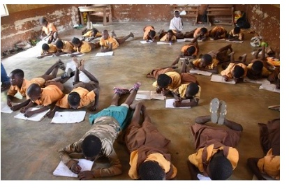 Some students lying on the floor during examinations