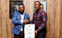 Richard Nii Armah Quaye with GhanaWeb's CEO, David Antwi, during the award presentation